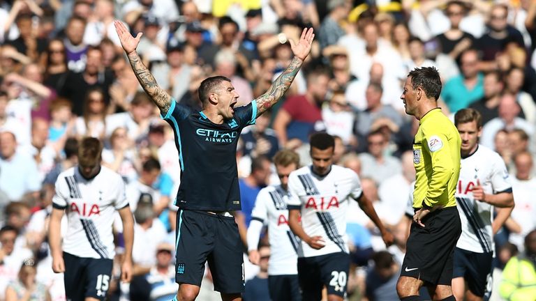 Manchester City's Aleksandar Kolarov (2nd L) gestures to referee Mark Clattenburg after possible offside is not given for Eric Dier's Tottenham goal