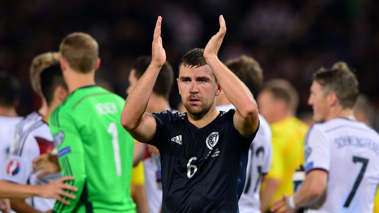 James McArthur of Scotland applauds the home support at the final whistle during the European Qualifier between Scotland and Germany