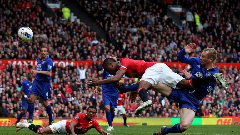 MANCHESTER, ENGLAND - APRIL 22:  Patrice Evra of Manchester United hits the post with a diving header during the Barclays Premier League match between Manc