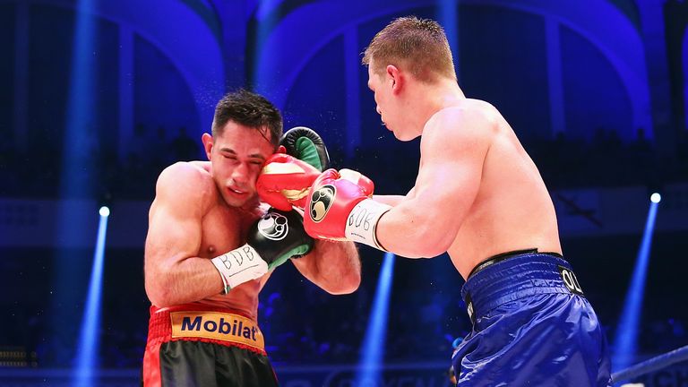 FRANKFURT AM MAIN, GERMANY - MAY 09:  Fedor Chudinov of Russia delivers a punch to Felix Sturm of Germany