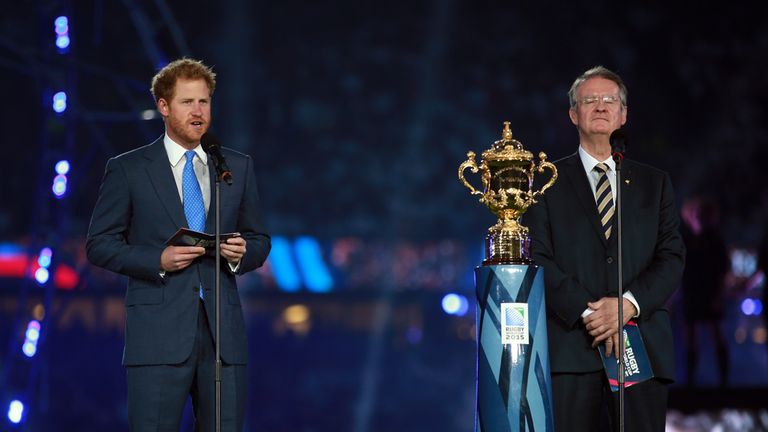 Prince Harry gives a speech alongside Chairman of World Rugby Bernard Lapasset during the opening ceremony of the Rugby World Cup