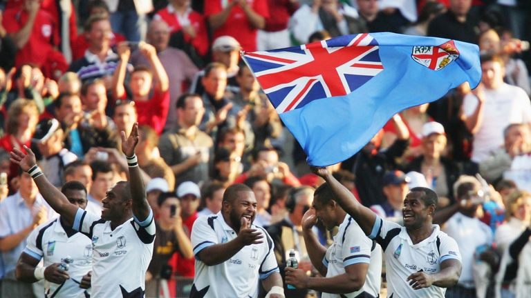 Fiji players celebrate following their team's 38-34 victory over Wales in 2007