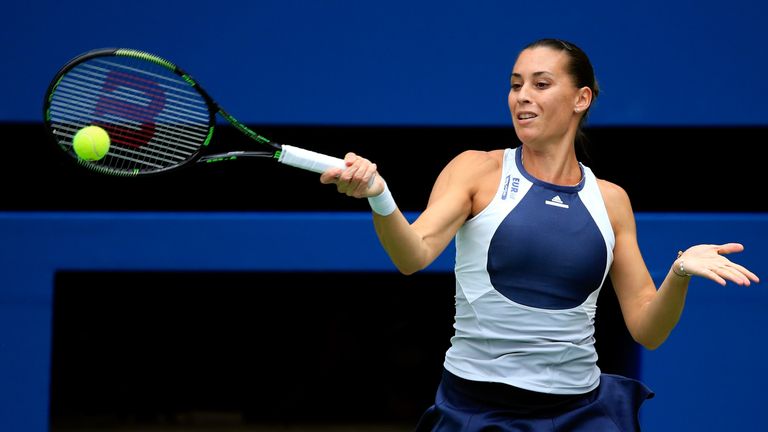Flavia Pennetta of Italy returns a forhand shot to Roberta Vinci of Italy during their Women's Singles Final match on Day Thi