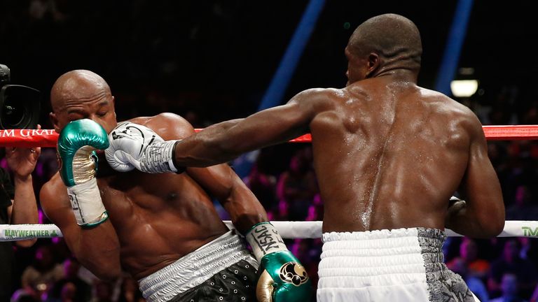 Andre Berto lands a left on Floyd Mayweather Jr. during their WBC/WBA welterweight title fight at MGM Grand Garden Arena on 