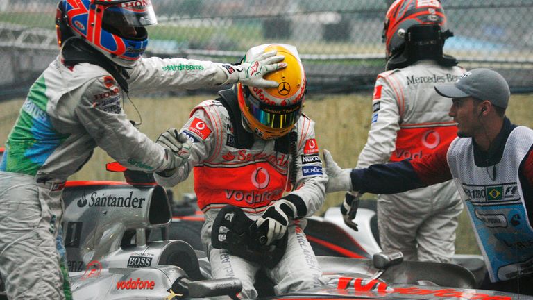 Jenson Button congratulates new Formula 1 World Champion Lewis Hamilton 