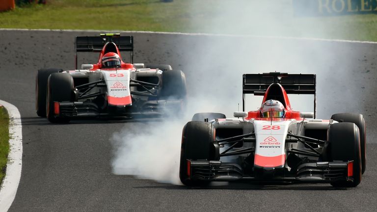 Will Stevens locks up as he leads Alexander Rossi