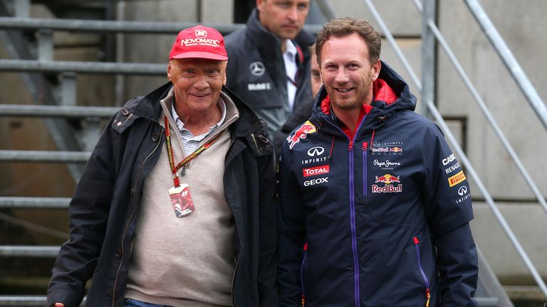 Niki Lauda, non-executive chairman of Mercedes GP walks with Red Bull Team Principal Christian Horner 