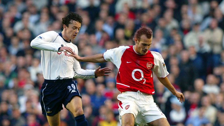 LONDON - NOVEMBER 16:  Fredrik Ljungberg (right) of Arsenal holds off Simon Davies of Tottenham Hotspur during a 2002 FA Barclaycard Premiership match