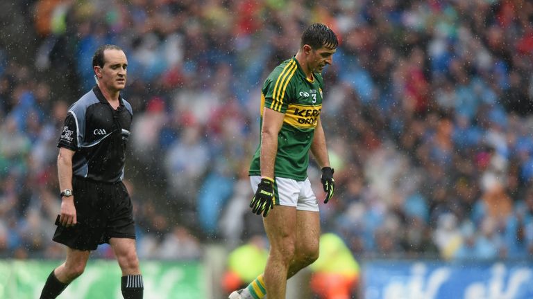 Kerry defender Aidan O'Mahony leaves the field after being black-carded by referee David Coldrick