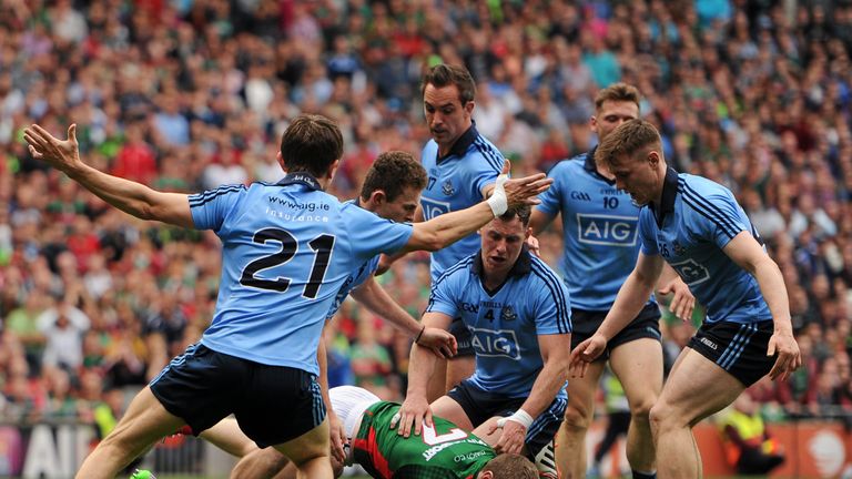 Colm Boyle is tripped by Philly McMahon (wearing four) for Mayo's late penalty