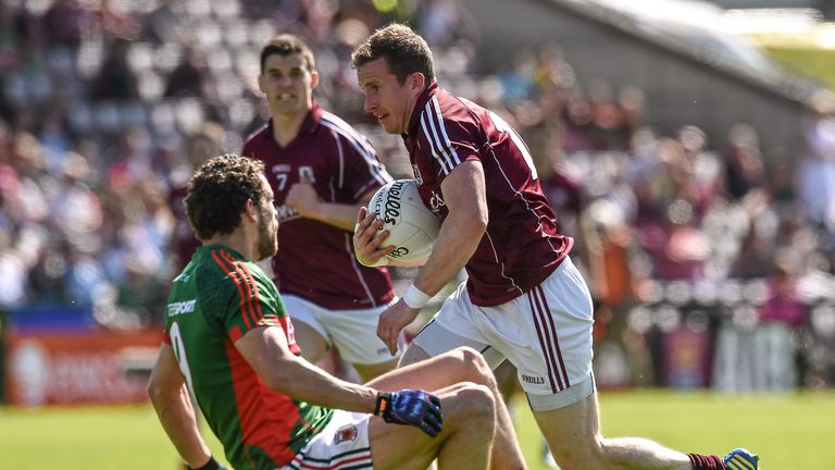 Gary Sice beats Mayo's Tom Parsons on his way to scoring Galway's first goal
