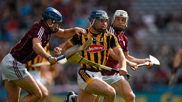 Kilkenny forward Ger Aylward is tracked by Johnny Coen and Andrew Smith during the Leinster final