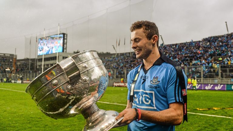 Jack McCaffrey celebrates in front of Hill 16 with the Sam Maguire Cup