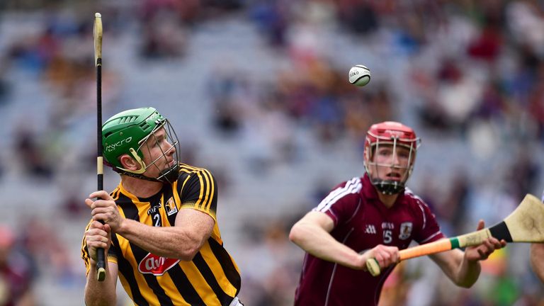 Kilkenny defender Paul Murphy clears his lines as Cathal Mannion watches on