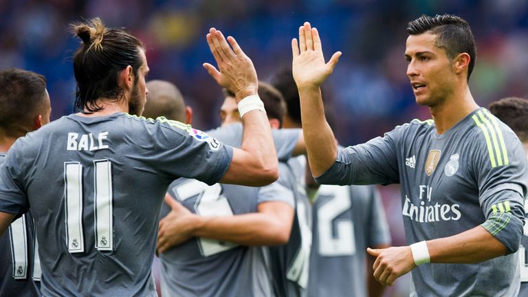 BARCELONA, SPAIN - SEPTEMBER 12: Cristiano Ronaldo (R) of Real Madrid CF is congratulated by his teammate Gareth Bale (L) after scoring his team's sixth go