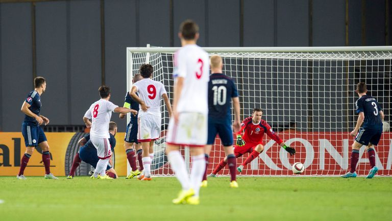 Georgia's Valeri Kazaishvili (8) fires home the opening goal of the game against Scotland