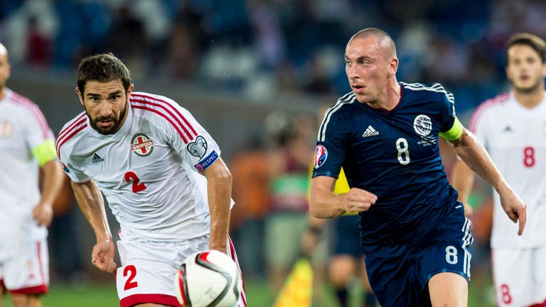 .Scotland captain Scott Brown (right) gets away from Ucha Lobzhanidze