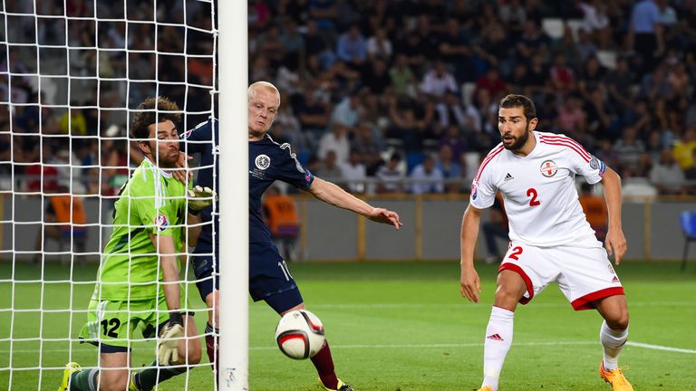 Scotland's Steven Naismith (centre) thought he had scored from Shaun Maloney's corner but the ball didn't cross the line