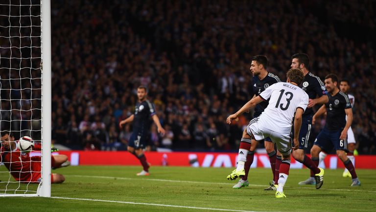 Thomas Mueller of Germany scores Germany's second goal against Scotlandn