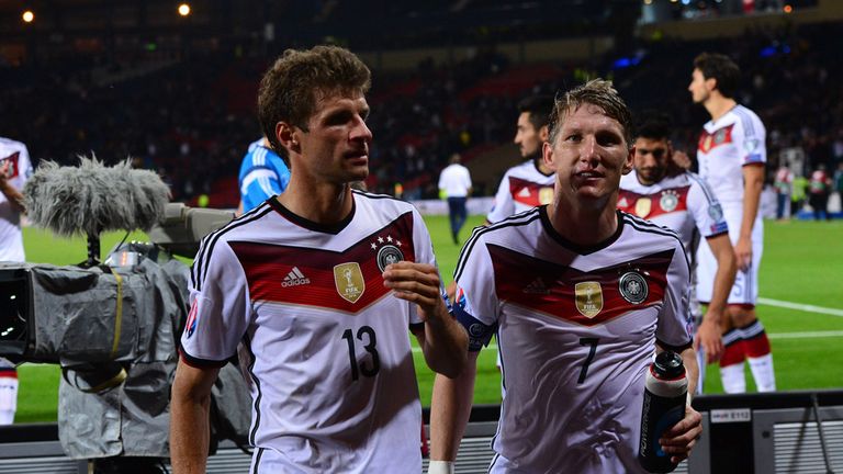 GLASGOW, SCOTLAND - SEPTEMBER 7 : Bastian Schweinsteiger and Thomas Muller of Germany celebrate at the final whistle during the EURO 2016 Qualifier between