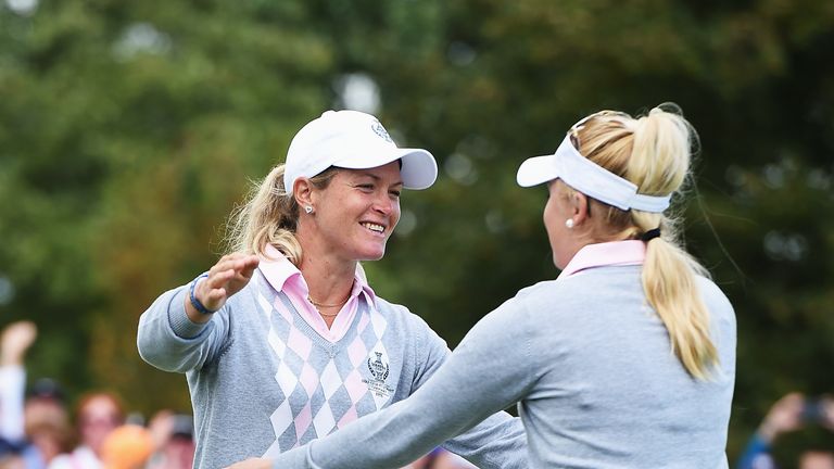 Suzann Pettersen celebrates with Charley Hull after winning their match during the morning foursomes  at The Solheim Cup