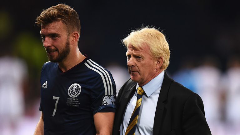 GLASGOW, SCOTLAND - SEPTEMBER 07:  Gordon Strachan, manager of Scotland leaves the field with James Morrison 