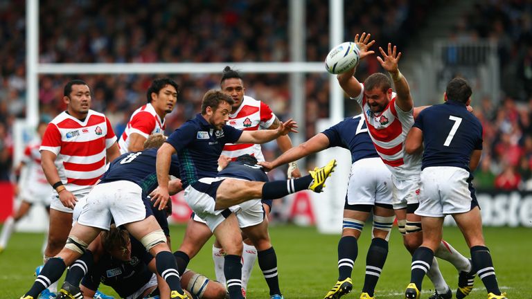  Michael Broadhurst of Japan tries to block as Greig Laidlaw of Scotland kicks