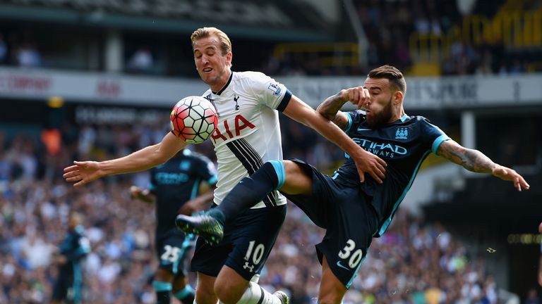 Harry Kane of Tottenham Hotspur and Nicolas Otamendi of Manchester City compete for the ball 