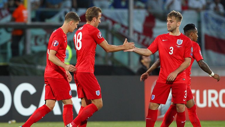  Harry Kane of England celebrates his goal with his team-mate Luke Shaw against San Marino