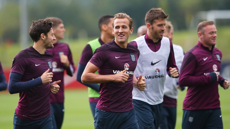 Tottenham team-mates Ryan Mason and Harry Kane warm up during an England training session at St George's Park