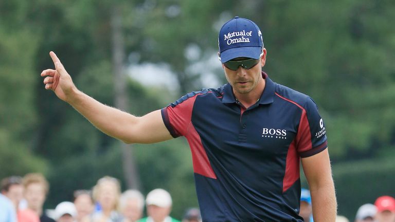 Henrik Stenson of Sweden celebrates an eagle putt on the ninth hole 