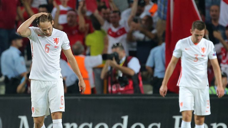 Netherlands' Daley Blind (L) gestures during defeat at Turkey