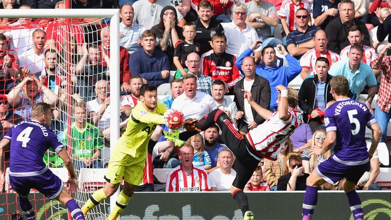 Goalkeeper Hugo Lloris of Tottenham Hotspur foils Ola Toivonen of Sunderland during the Barclays Premier League match 