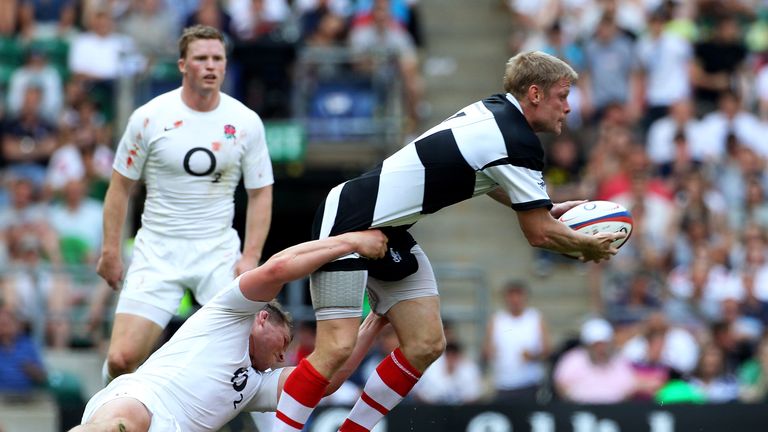 Iain Balshaw, playing for the Barbarians, is tackled by England's Dylan Hartley in 2012