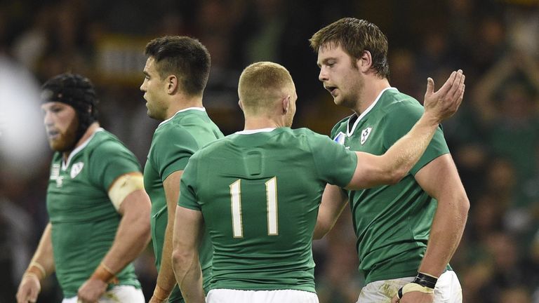 Iain Henderson (R) celebrates after scoring a try for Ireland against Canada