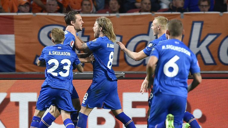 Iceland's midfielder Gylfi Thor Sigurdsson (2nd L) celebrates after scoring a penalty kick