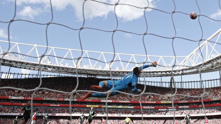 Jack Butland dives accross the Stoke City goal mouth during the English Premier League football match between Arsenal and Stoke