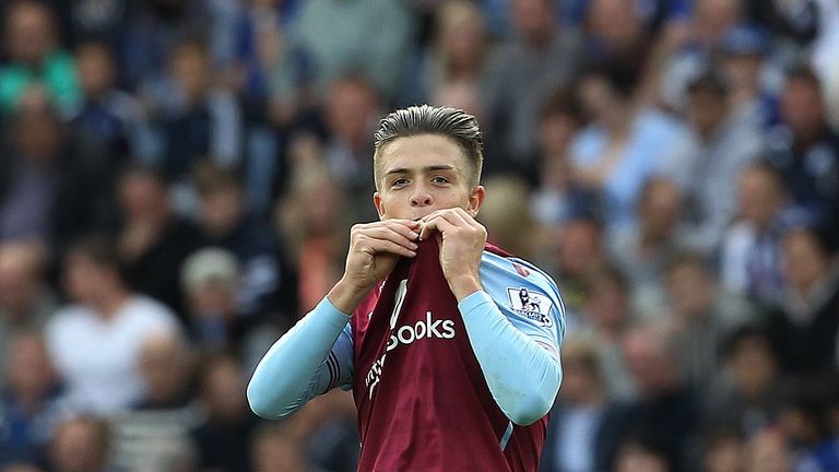 Jack Grealish celebrates after scoring the opening goal of the Premier League match between Leicester City and Aston Villa