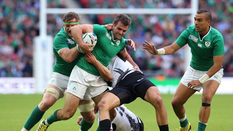 Jared Payne (centre) drives on against Romania