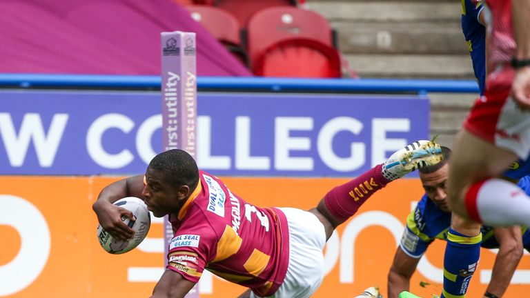 Huddersfield's Jermaine McGillvary scores one of his four tries against Warrington.