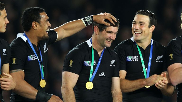 Jerome Kaino of the All Blacks (L) shares a joke with teammate Stephen Donald on the winners podium after the 2011 World Cup final