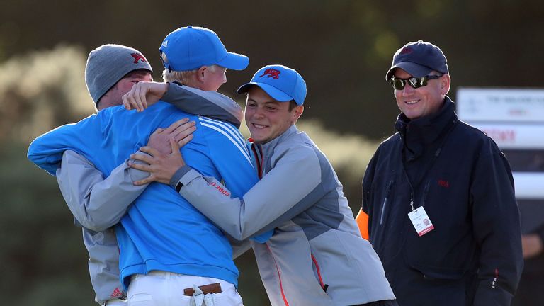 Great Britain and Ireland's Jimmy Mullen is congratulated by team-mates Jack Hume and Jack McDonald during day one of the Walker Cup
