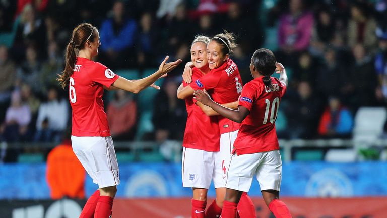 Jo Potter (second from right) celebrates after doubling the England lead