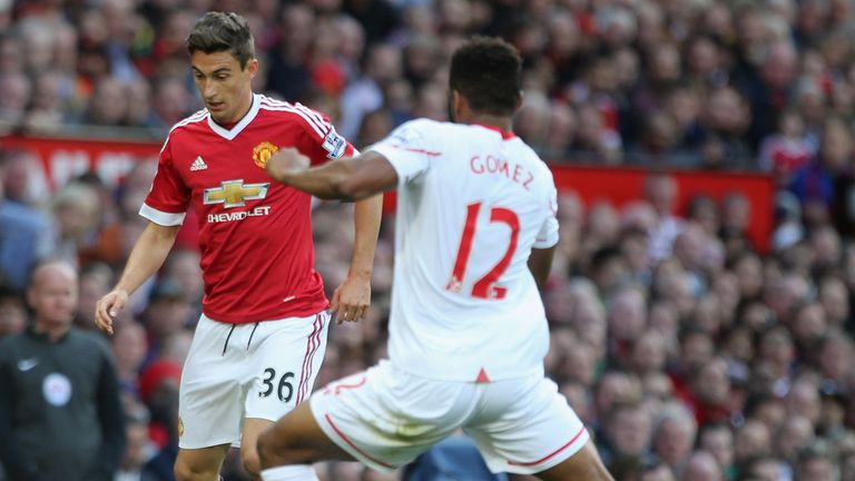 Matteo Darmian of Manchester United in action with Liverpool's Joe Gomez