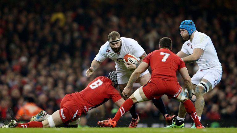 Joe Marler of England is tackled by Dan Lydiate of Wales during the Six Nations match between the sides at the Millennium Stadium on February 6, 2015. 
