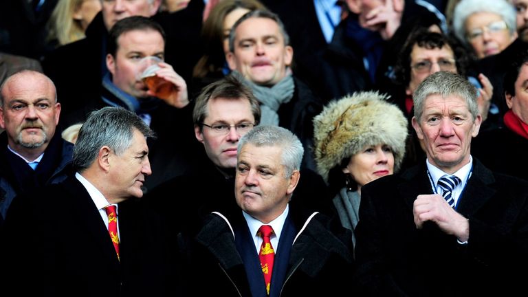 British and Irish Lions Head Coach Warren Gatland (C) watches with former Scotland player John Jeffrey