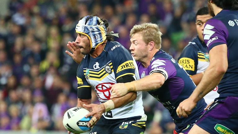 Johnathan Thurston of the Cowboys passes the ball during the NRL Second Preliminary Final match against Melbourne Storm