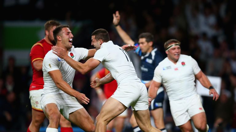 Jonny May of England (11) celebrates with Sam Burgess as he scores their first try during the 2015 Rugby World Cup Pool A clash v Wales at Twickenham
