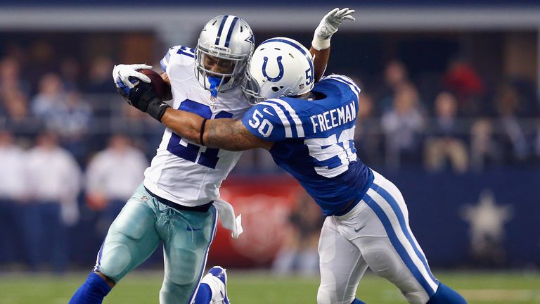 Joseph Randle #21 of the Dallas Cowboys carries the ball against  Jerrell Freeman #50 of the Indianapolis Colts at AT&T Stadi