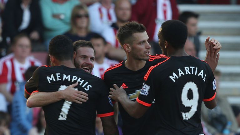 Juan Mata of Manchester United celebrates with team-mates